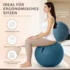 A woman is sitting on a blue exercise ball in a room. Produktbild-Vorschau
