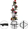 A multi-tiered metal plant stand filled with various potted plants. Náhľad obrázku produktu