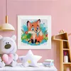 A diamond painting kit of a fox is displayed on a pink wall above a shelf with a teddy bear and books. Produktbild-Vorschau