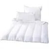 A white duvet and pillow set arranged on a white background. Produktbild-Vorschau