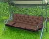 A brown tufted cushion set on a garden swing. Produktbild-Vorschau