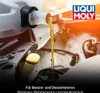 Motor oil being poured from a container into an engine. Produktbild-Vorschau
