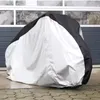 A bicycle cover is shown in front of a garage door. Náhľad obrázku produktu