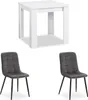 A white dining table with two gray chairs. Produktbild-Vorschau