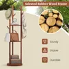 A coat rack with accessories displayed in an outdoor setting with trees. Náhľad obrázku produktu
