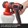 A hand is holding a red and black paint sprayer with a white container attached. Produktbild-Vorschau
