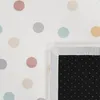 A close-up view of a rug with a polka dot pattern and a non-slip backing. Produktbild-Vorschau