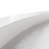 A close-up view of the edge of a white shower tray with a textured surface below. Anteprima dell’immagine prodotto
