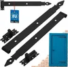 A set of black metal hinges and mounting hardware, with a small blue door shown in the background. Náhľad obrázku produktu