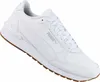 A white Puma sneaker with a brown sole is shown against a white background. Produktbild-Vorschau