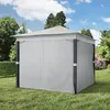 A gray gazebo with closed side panels sits on a green lawn in a garden setting. Produktbild-Vorschau