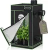 A black and green indoor grow tent with plants inside, shown with the front flap partially open. Podgląd zdjęcia produktu
