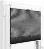 A pleated blind is shown mounted in a white window frame. Anteprima dell’immagine prodotto
