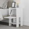 A white nightstand next to a bed. Produktbild-Vorschau