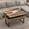 A coffee table with a lift-top function is placed in a living room setting next to a sectional sofa. Voir les images du produit