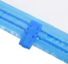 A close-up of a blue plastic clip on a clear plastic bag with blue stripes. Náhľad obrázku produktu