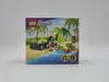 The image shows the front of a LEGO Friends toy box, depicting a beach scene with a rescue vehicle and animal figures. Náhled obrázku produktu
