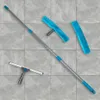 A window cleaning set with an extendable pole, squeegee, and microfiber covers, laid out on a tiled floor. Podgląd zdjęcia produktu