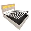 A bed frame with a lift-up mattress base, revealing storage underneath. The headboard has integrated lighting and shelving. Produktbild-Vorschau