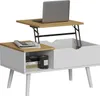 A white coffee table with a lift-top function, showing a laptop on the raised section and a newspaper on the lower section. Voir les images du produit