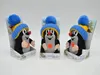 Three plush toys of a mole wearing a blue and yellow hat with a blue pom-pom, each in its own display packaging. Produktbild-Vorschau