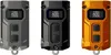 Three Nitecore TINI 3 LED keychain flashlights in different colors (gray, black, and orange) are displayed side-by-side against a white background. Podgląd zdjęcia produktu