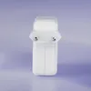 A white Apple power adapter is centered against a light purple background. Produktbild-Vorschau
