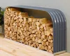 A firewood rack filled with logs, placed on a wooden deck against a textured wall. Produktbild-Vorschau