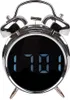 A close-up studio shot of a silver alarm clock with a digital display. Náhled obrázku produktu