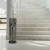 A decorative metal sign with the text "Herzlich Willkommen" (Welcome) stands on a marble floor in front of a marble staircase. Produktbild-Vorschau