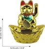 A golden lucky cat figurine sits in a golden bowl filled with coins, with measurement indicators on the left and bottom. Produktbild-Vorschau