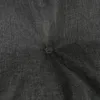 A close-up view of a dark gray tufted cushion, showing the texture of the fabric and the stitching of the tuft. Produktbild-Vorschau