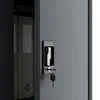 A close-up view of a metal cabinet lock and key, with the edge of a filing cabinet visible. Produktbild-Vorschau