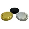 Three jar lids in different colors (gold, silver, and black) are arranged on a white background. Produktbild-Vorschau