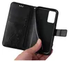 A hand holding open a black flip phone case with a floral design. Produktbild-Vorschau