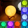 A collage of different colored moon lamps on stands. Podgląd zdjęcia produktu