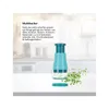 A kitchen counter with a food chopper and chopped herbs. Produktbild-Vorschau