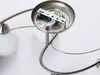 A close-up view of the wiring and mounting bracket of a ceiling light fixture. Produktbild-Vorschau