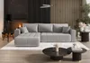 A modern living room with a large sectional sofa, fireplace, and coffee tables. Produktbild-Vorschau