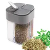 A multi-compartment spice container with dried herbs and a sprig of fresh herbs next to it. Produktbild-Vorschau