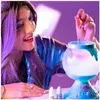 A young person with purple hair is making a potion in a glowing orb. Náhled obrázku produktu