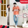 A couple is standing in a doorway, looking at a tablet. The woman is peeking out from behind a door. Produktbild-Vorschau