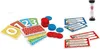 A collection of game components, including cards, tokens, and an hourglass timer, arranged on a white background. Produktbild-Vorschau