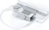 A close-up studio shot of a silver USB-C hub with white cables attached, placed on a white background. Produktbild-Vorschau