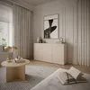 A modern living room with a sideboard, coffee table, rug, and curtains. Voir les images du produit
