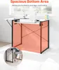 A sewing table with a sewing machine on top, placed near a window. The lower part of the table is highlighted in orange to show spacious legroom. Produktbild-Vorschau