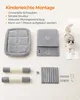 A flat lay of cat tree components and assembly instructions, with a cat in the background. Produktbild-Vorschau