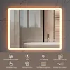 A modern bathroom mirror with integrated LED lighting, displayed against a tiled wall and above a bathtub. Anteprima dell’immagine prodotto