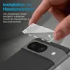 A hand is shown applying a camera lens protector to a smartphone. Produktbild-Vorschau