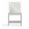 A vanity table with a mirror and lights. Anteprima dell’immagine prodotto